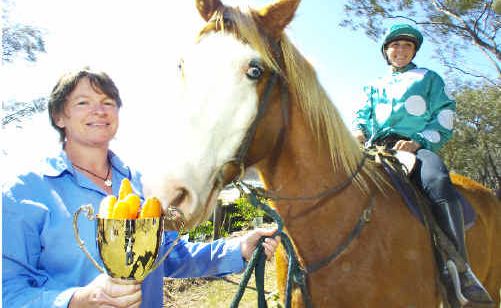 Chief executive officer of Ballina Jockey Club Sarah Wills with clerk of the course Ellisha Leonard, aboard Paint, and the 2009 version of the Byron Bay Cup. Chief executive officer of Ballina Jockey Club Sarah Wills with clerk of the course Ellisha Leonard, aboard Paint, and the 2009 version of the Byron Bay Cup.